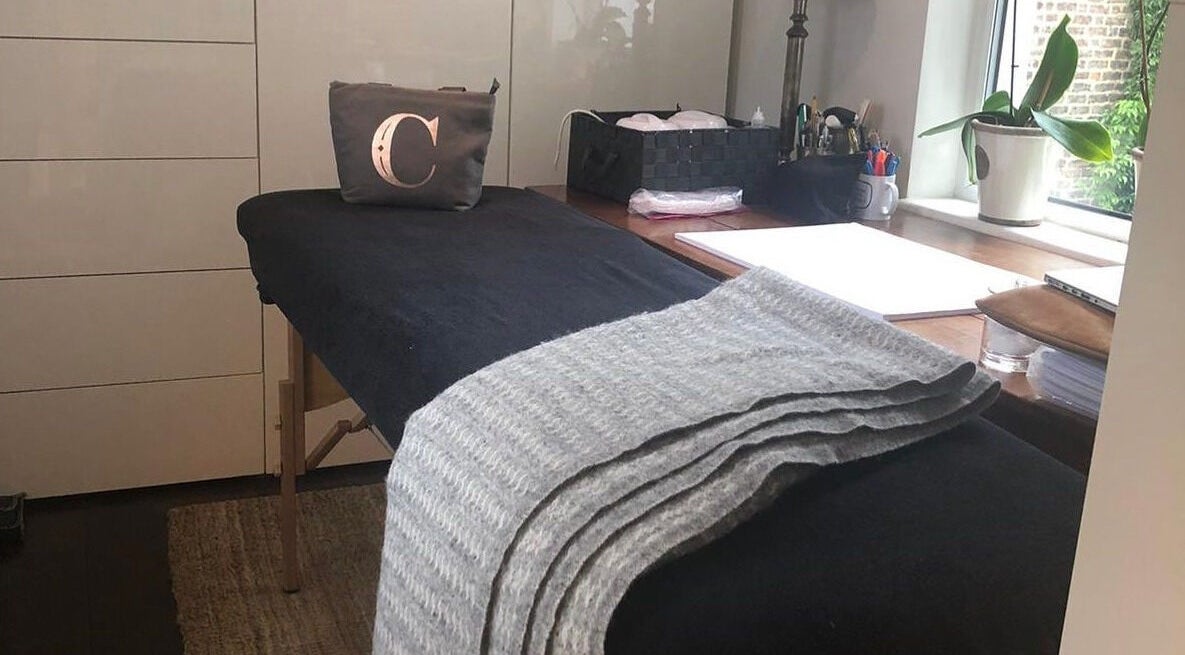 Massage table in Casa Prado Mobile, London, England, GB with natural light and serene ambiance.