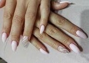 Elegant pastel pink nails at Enana Ladies Beauty Salon, Dubai, Dubai, AE, showcasing detailed artistry.
