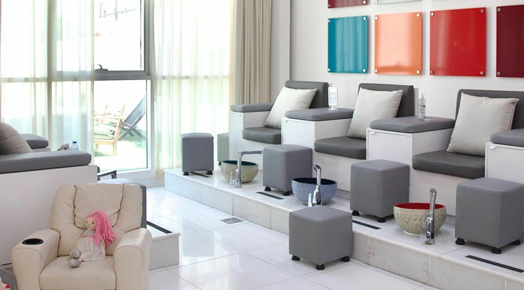 Relaxing pedicure lounge at Color Me Spa, Abu Dhabi, AE with comfy seating and colorful decor.