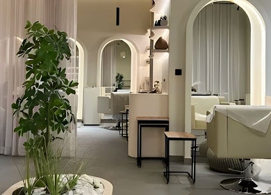 Elegant interior of SOLO wellness venue in Ajman, Ajman, AE featuring soothing arches and greenery.