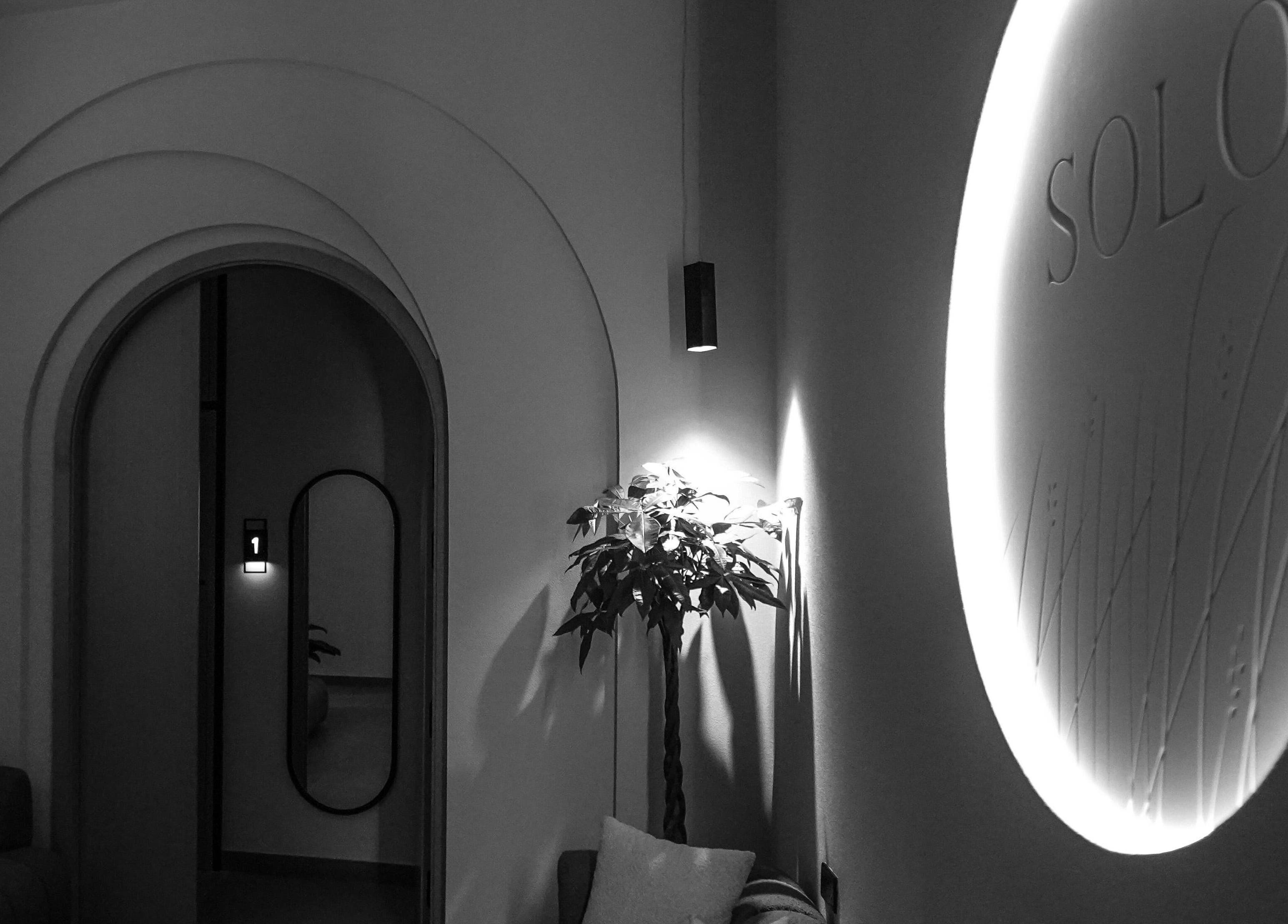 SOLO wellness venue's stylish archway in Ajman, Ajman, AE, featuring sleek design and ambient lighting.