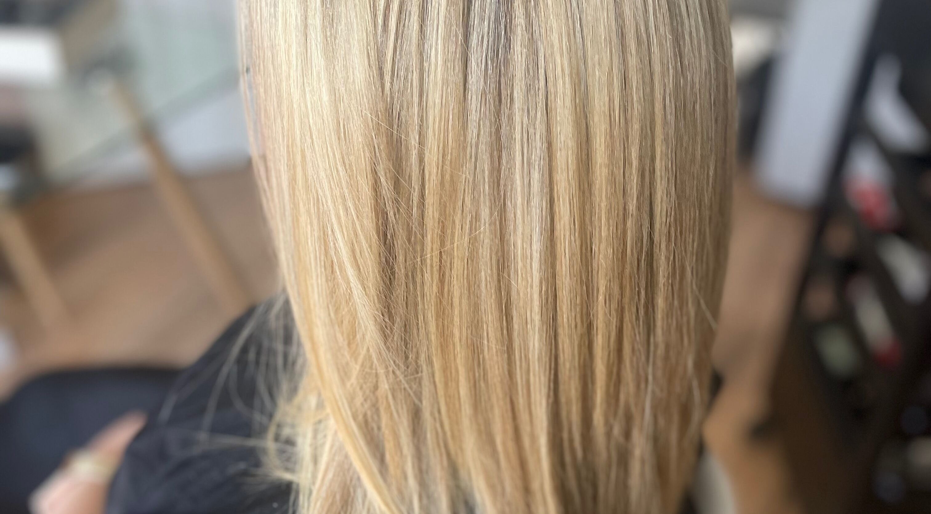 Elegant blonde hair styled smoothly at Hair by Adele, Winsford, England, GB.