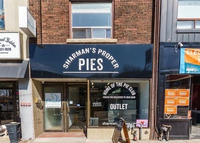 View of businesses near Royal Eden Spa, Toronto, Ontario, CA, featuring shops and vibrant signage.