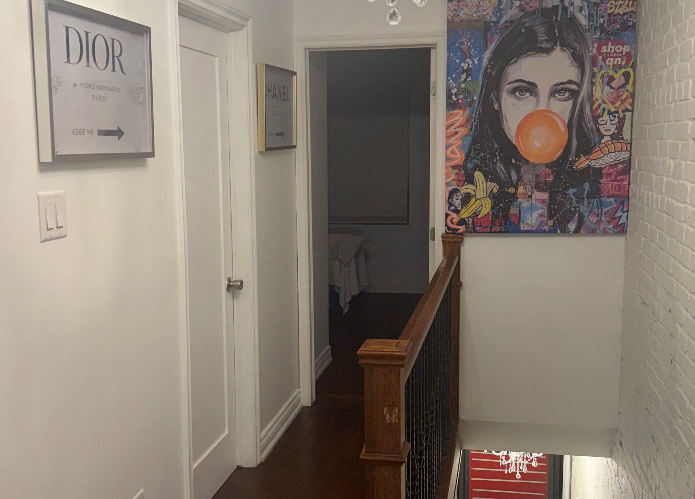 Art-filled hallway at Royal Eden Spa, Toronto, Ontario, CA, featuring vibrant decor and artwork.