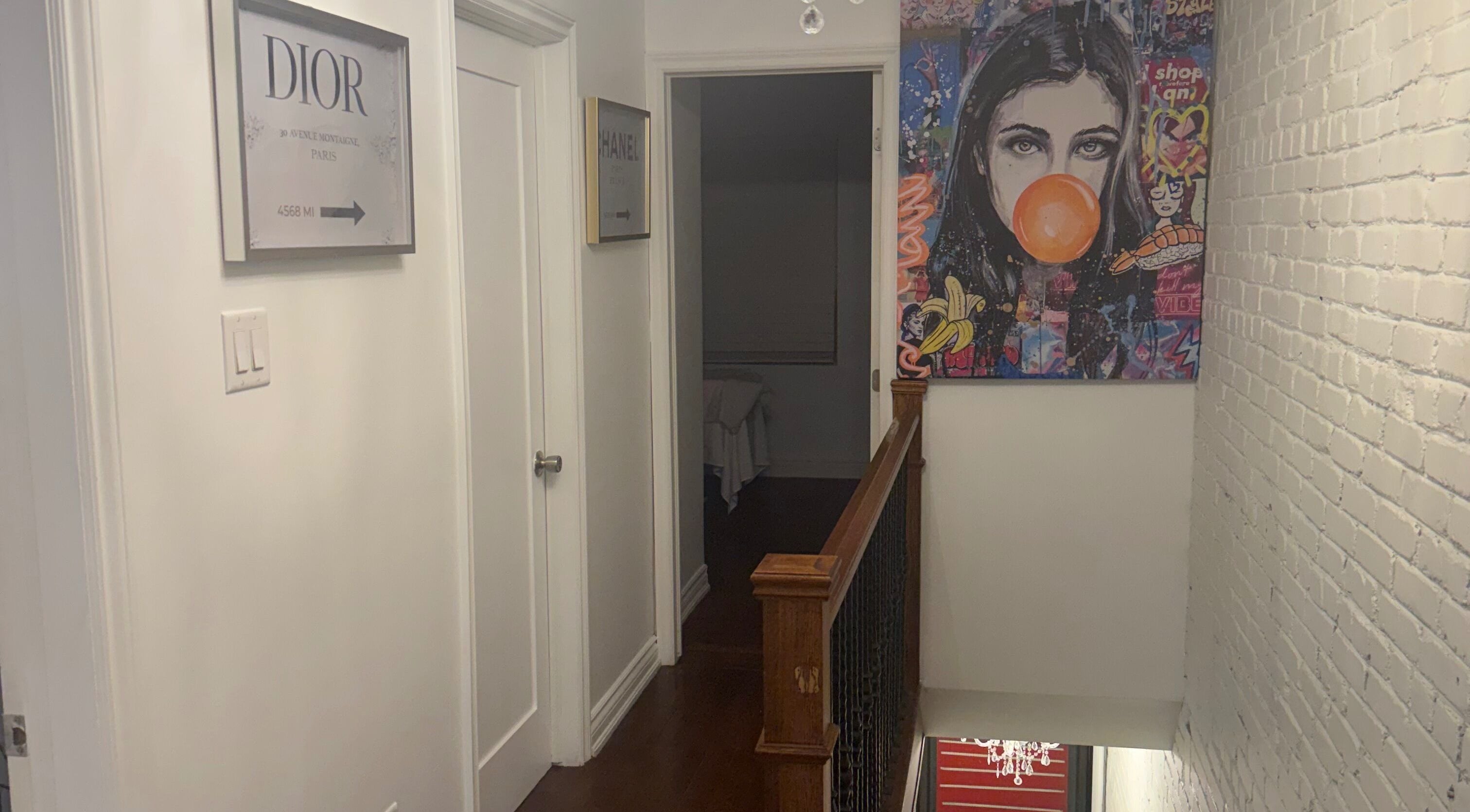 Art-filled hallway at Royal Eden Spa, Toronto, Ontario, CA, featuring vibrant decor and artwork.