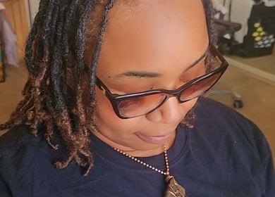 Person with sunglasses enjoying a moment at Nurishin Knotts, Charlotte, North Carolina, US.