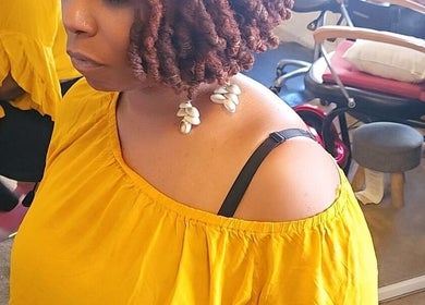 Elegant hairstyle at Nurishin Knotts in Charlotte, North Carolina, US, showcasing intricate braiding details.