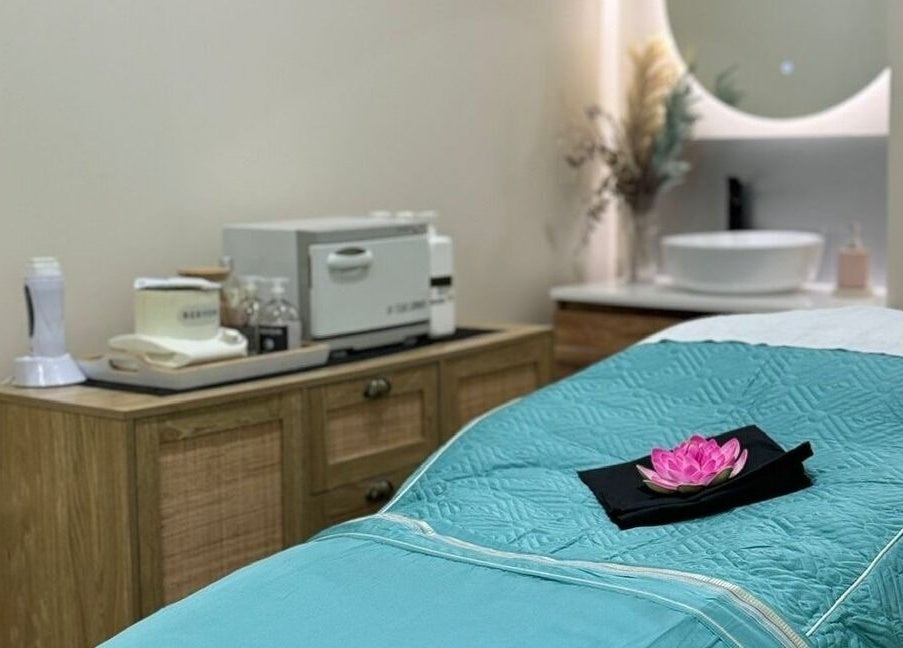 Relaxing treatment room at The Beauty Station | Takanini, Auckland, Auckland, NZ with a teal massage table.