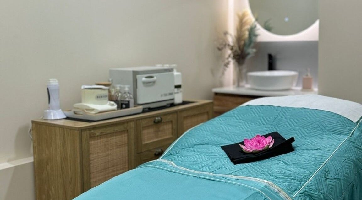 Serene treatment room at The Beauty Station | Takanini, Auckland, Auckland, NZ featuring a teal bedspread.