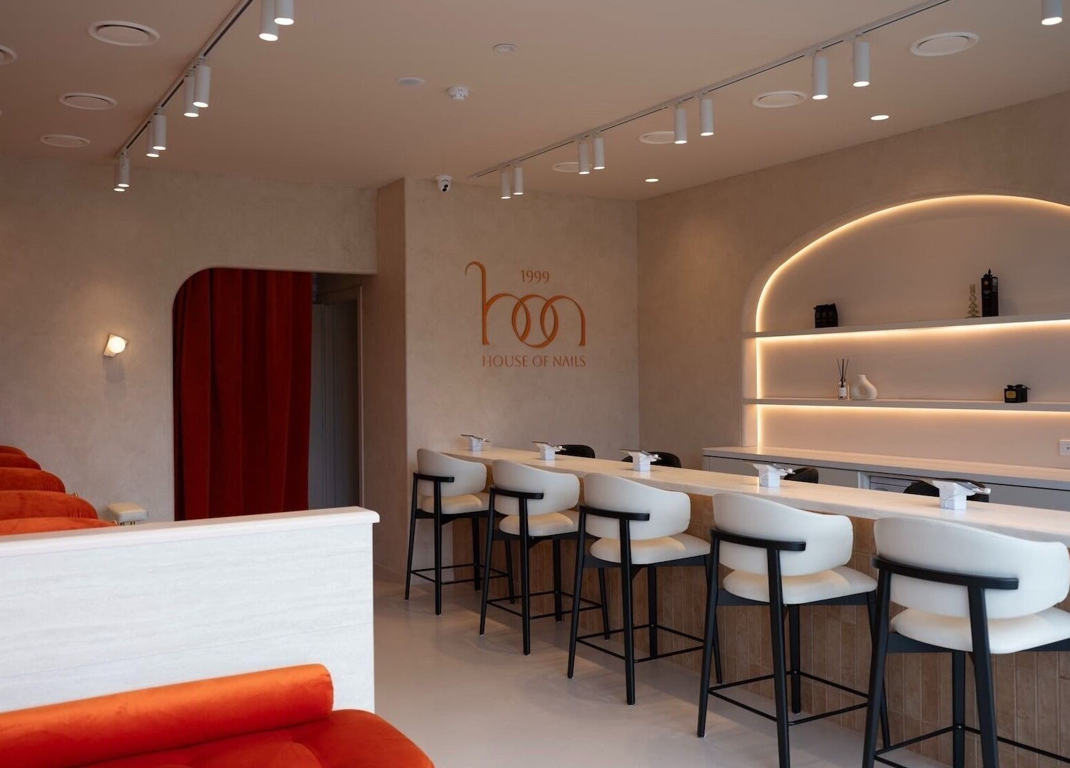 Stylish interior of 1999 House of Nails - Ferrymead in Christchurch, Canterbury, NZ, featuring modern decor and seating.