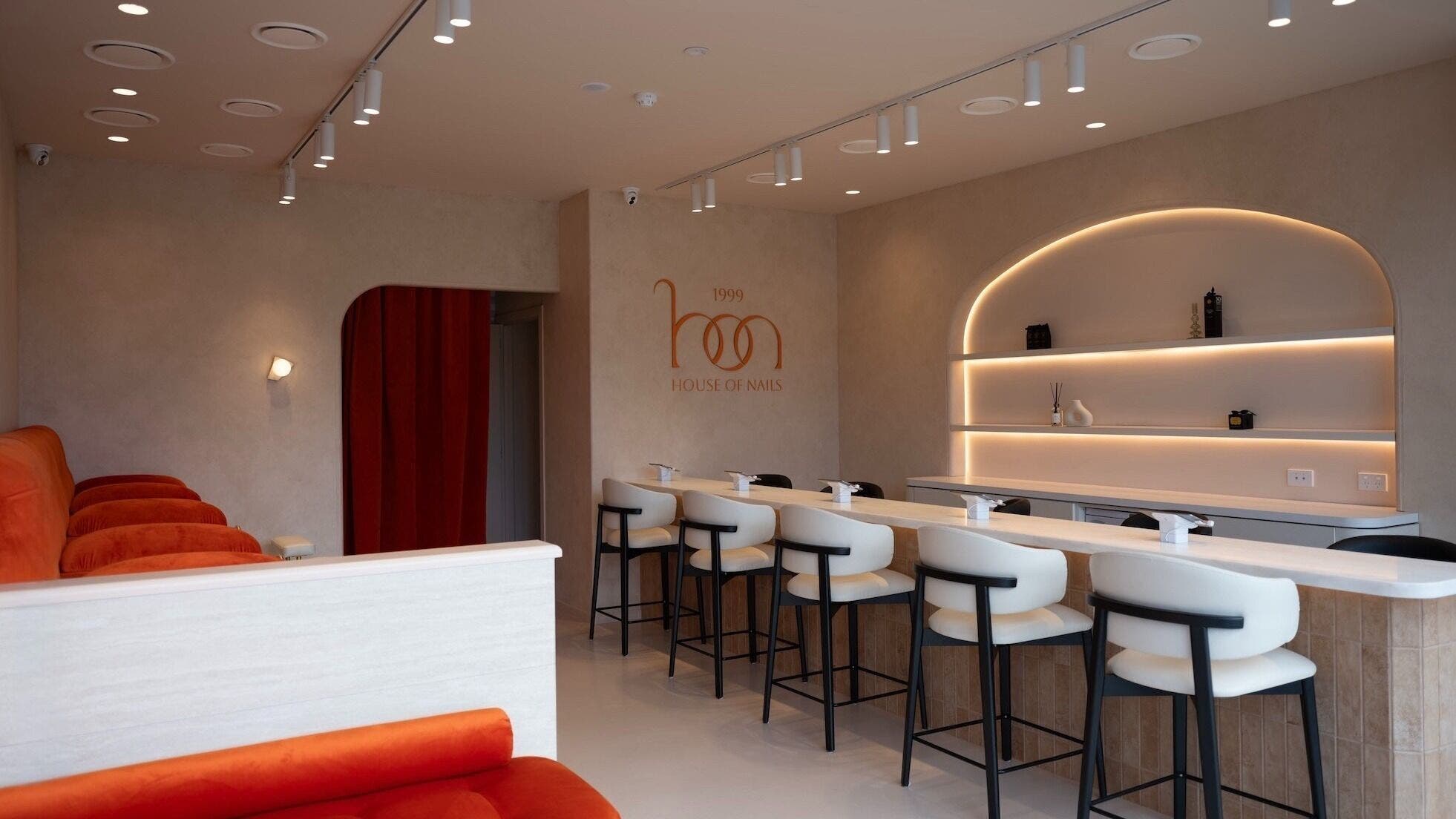 Stylish interior of 1999 House of Nails - Ferrymead in Christchurch, Canterbury, NZ, featuring modern decor and seating.