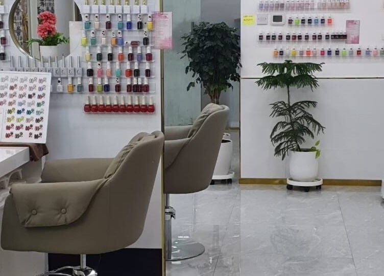 Chic nail station at Companion Beauty Salon and Spa Khalidiyah Mall, Abu Dhabi, AE, with vibrant polish display.