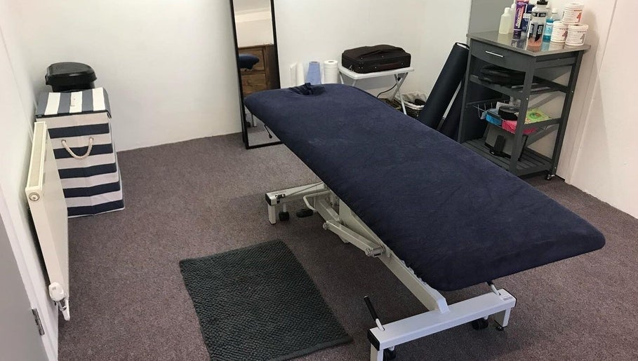 Therapy room at Farnborough Sports Massage in Farnborough, England, GB with massage table and soothing decor.