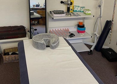 Massage room at Farnborough Sports Massage, Farnborough, England, GB, equipped with essential therapy tools.