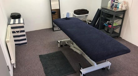 Farnborough Sports Massage therapy room with treatment table in Farnborough, England, GB.