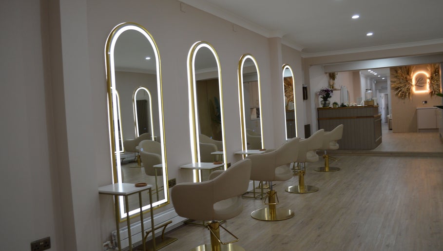 Modern salon interior at Lounais - Formerly Guys and Dolls, Burton Upon Trent, England, GB with stylish mirrors.