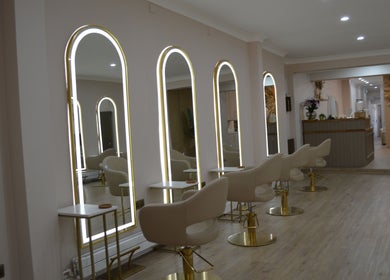 Modern salon interior at Lounais - Formerly Guys and Dolls, Burton Upon Trent, England, GB with stylish mirrors.