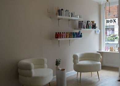Elegant seating area in Lounais - Formerly Guys and Dolls, Burton Upon Trent, England, GB with stylish shelves.