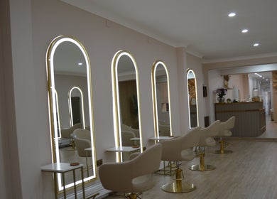 Chic beauty salon interior with modern lighting at Lounais - Formerly Guys and Dolls, Burton Upon Trent, England, GB.