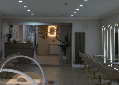 Elegant salon interior at Lounais, Burton Upon Trent, England, GB, featuring modern styling chairs and mirrors.