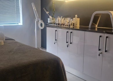 Relaxing treatment room at Wink Beauty Salon & Spa, Sandton, Gauteng, ZA with modern decor and beauty equipment.