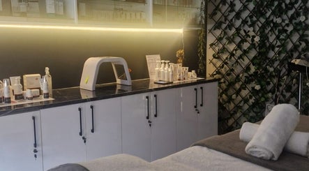 Relaxing treatment area at Wink Beauty Salon & Spa, Sandton, Gauteng, ZA, featuring plush towels and products.
