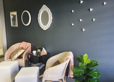 Relaxing seating area at Wink Beauty Salon & Spa in Sandton, Gauteng, ZA with elegant decor and cozy seats.