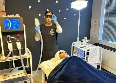 Technician performs laser treatment at Wink Beauty Salon & Spa, Sandton, Gauteng, ZA.