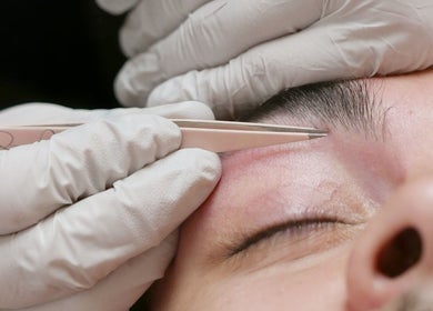 Expert eyebrow tweezing at Allure Aesthetics Beauty and Waxing Salon in Gilbert, Arizona, US.