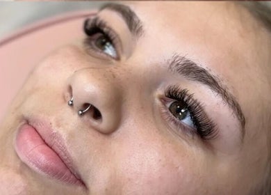 Client with styled eyelashes at Allure Aesthetics Beauty and Waxing Salon in Gilbert, Arizona, US.