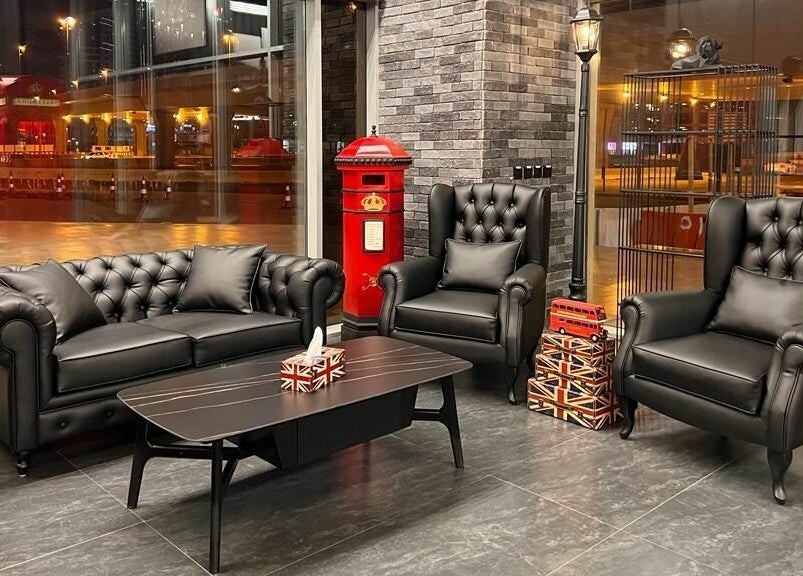 Luxurious black seating at London Base Barbershop - Business Bay, Dubai, AE with stylish decor and ambient lighting.