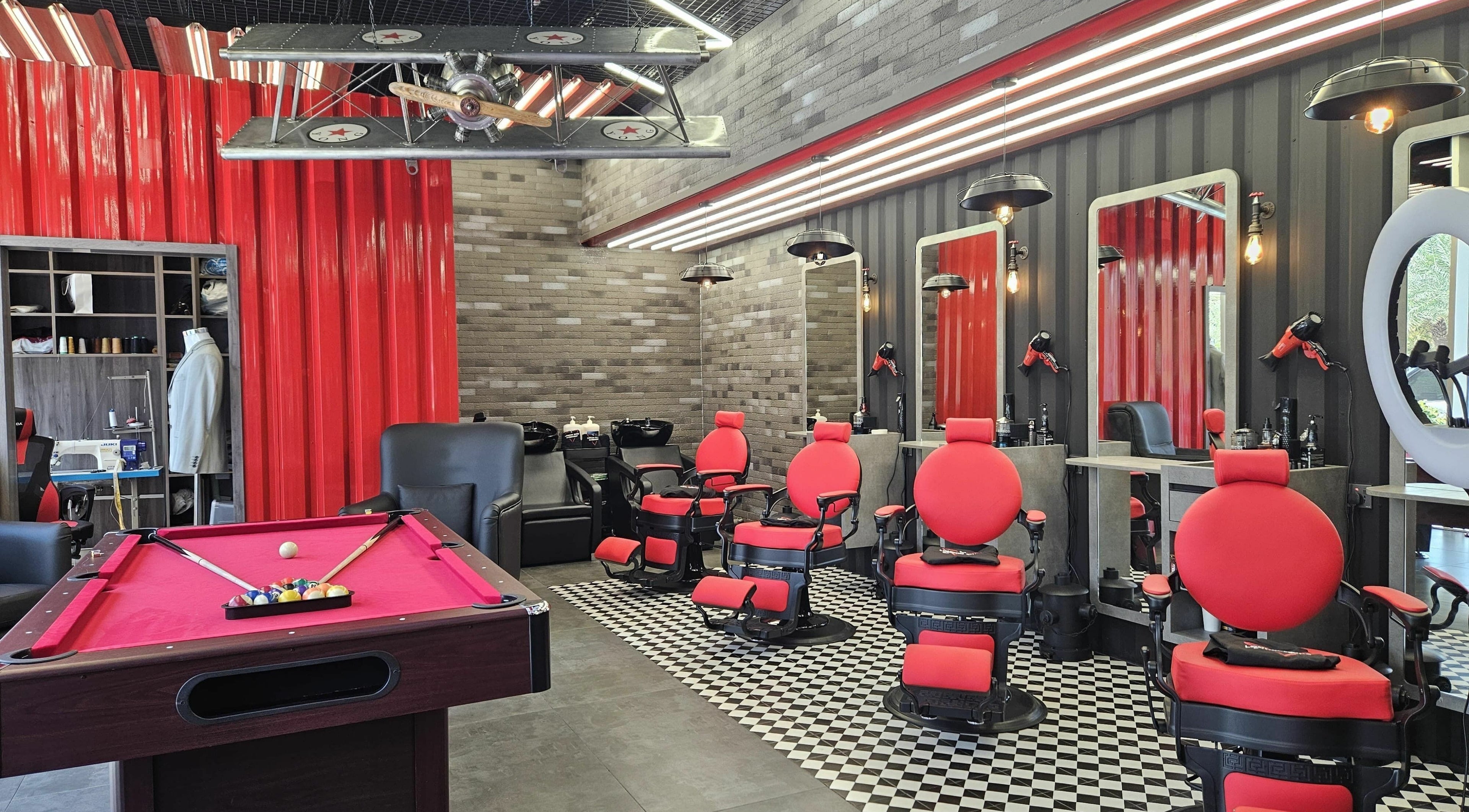 Chic barber chairs and pool table at London Base | Jumeirah Village Circle, Dubai, Dubai, AE.