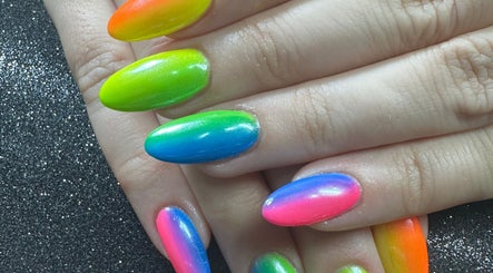 Colorful gradient nails at Emi Nail Art, Gibraltar, GI showcasing vibrant nail design.