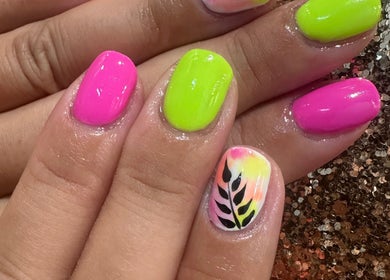 Bright neon nail art with floral design at Emi Nail Art, Gibraltar, GI.