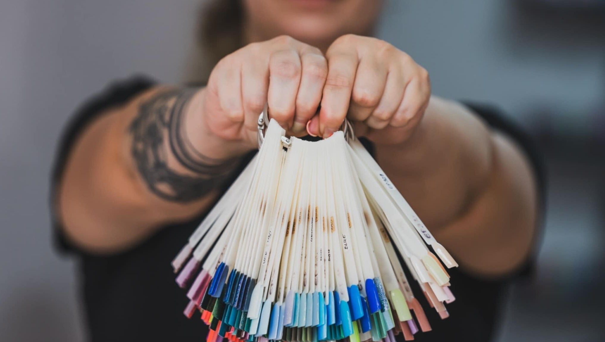 Color palette selection at Emi Nail Art, Gibraltar, GI showcasing diverse nail polish options.