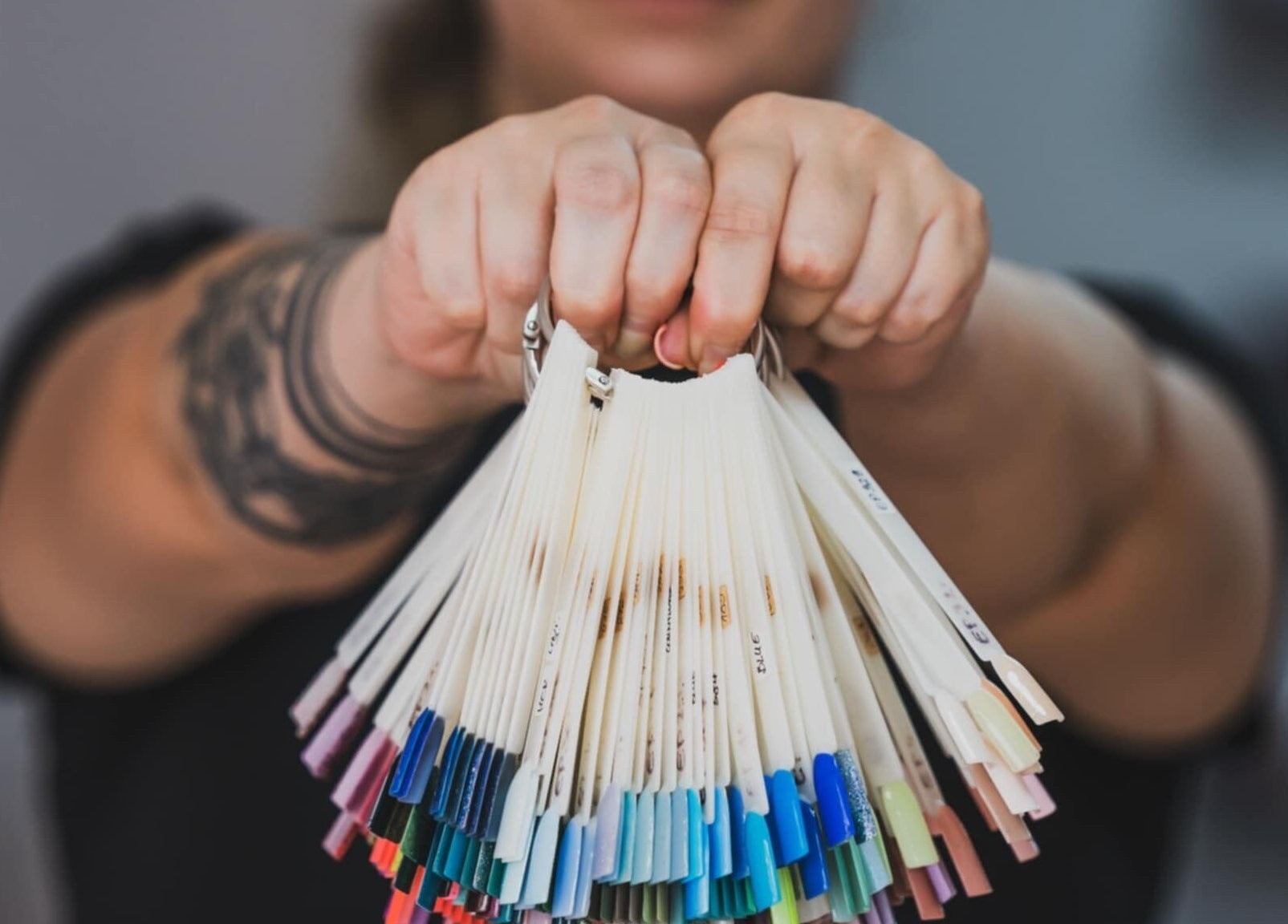 Color palette selection at Emi Nail Art, Gibraltar, GI showcasing diverse nail polish options.