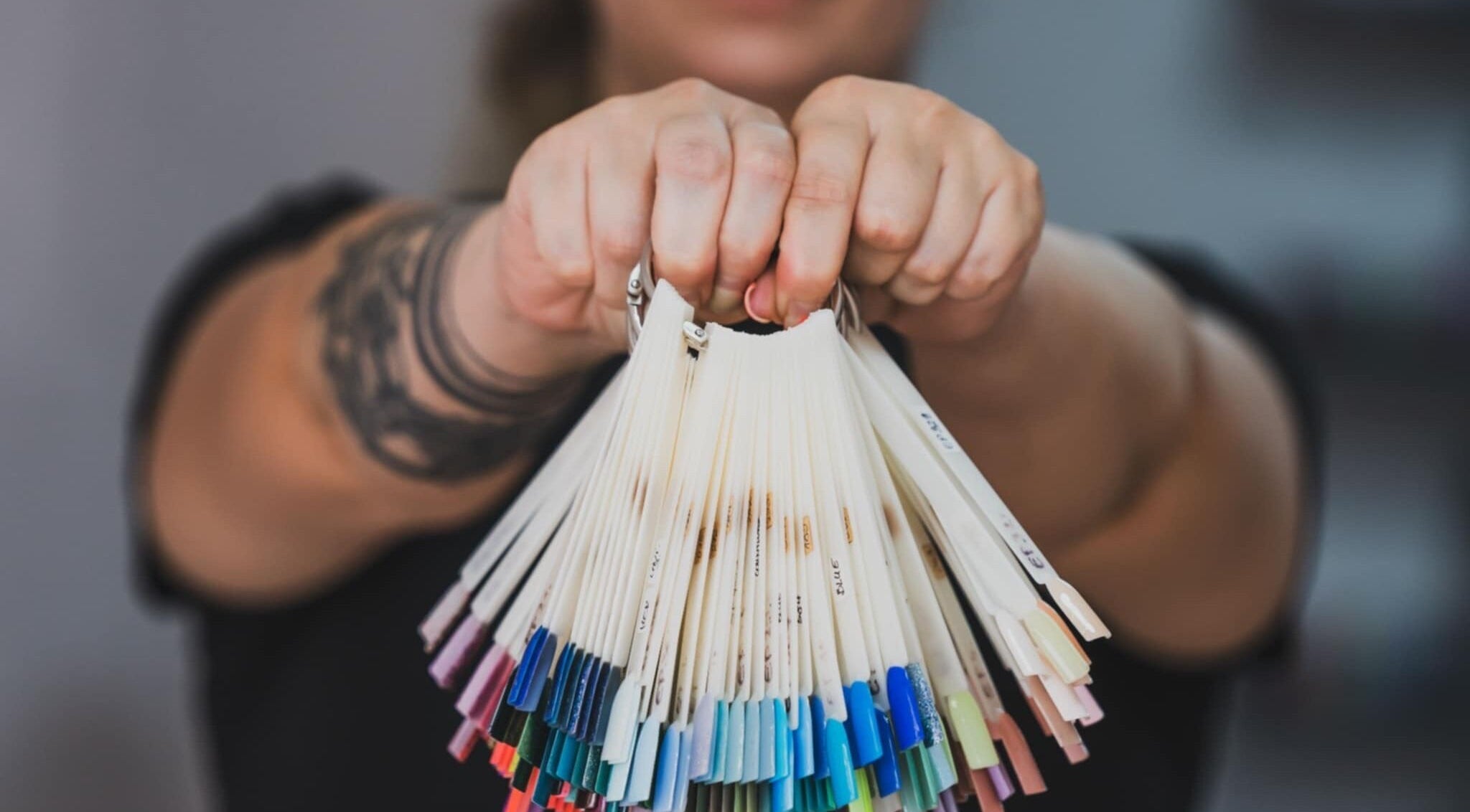 Color palette selection at Emi Nail Art, Gibraltar, GI showcasing diverse nail polish options.
