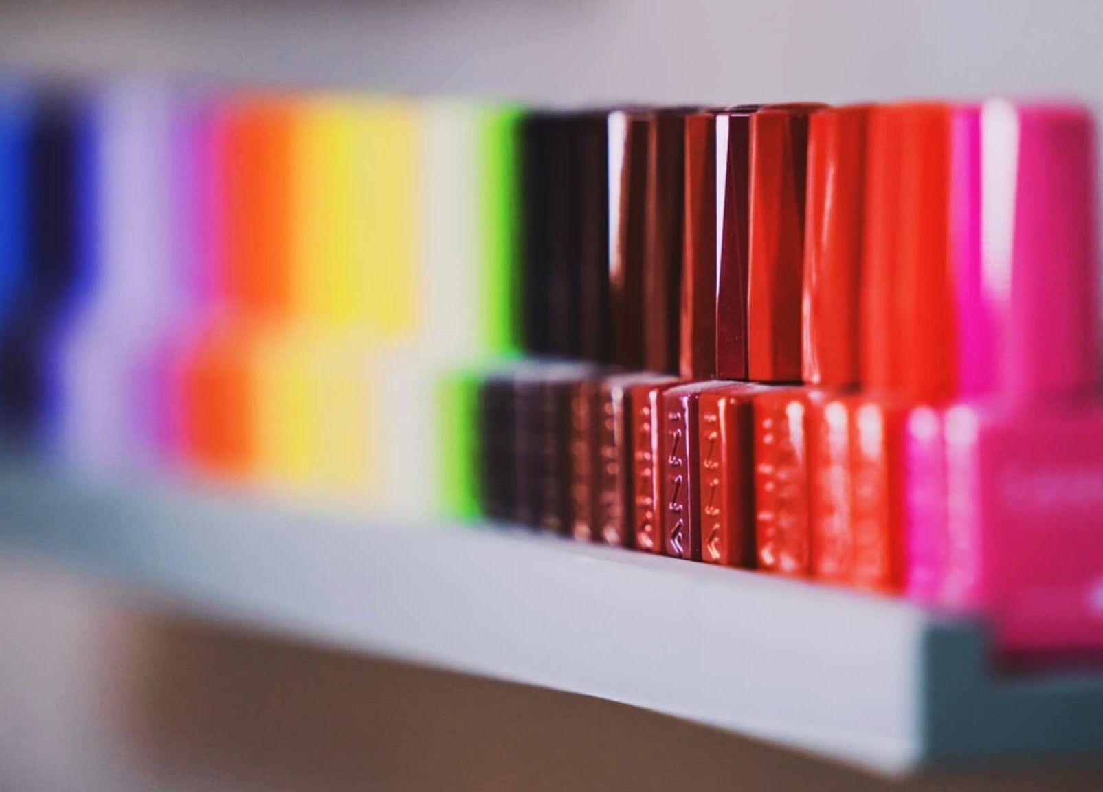 Vibrant nail polish collection at Emi Nail Art, Gibraltar, GI, showcasing diverse colors.