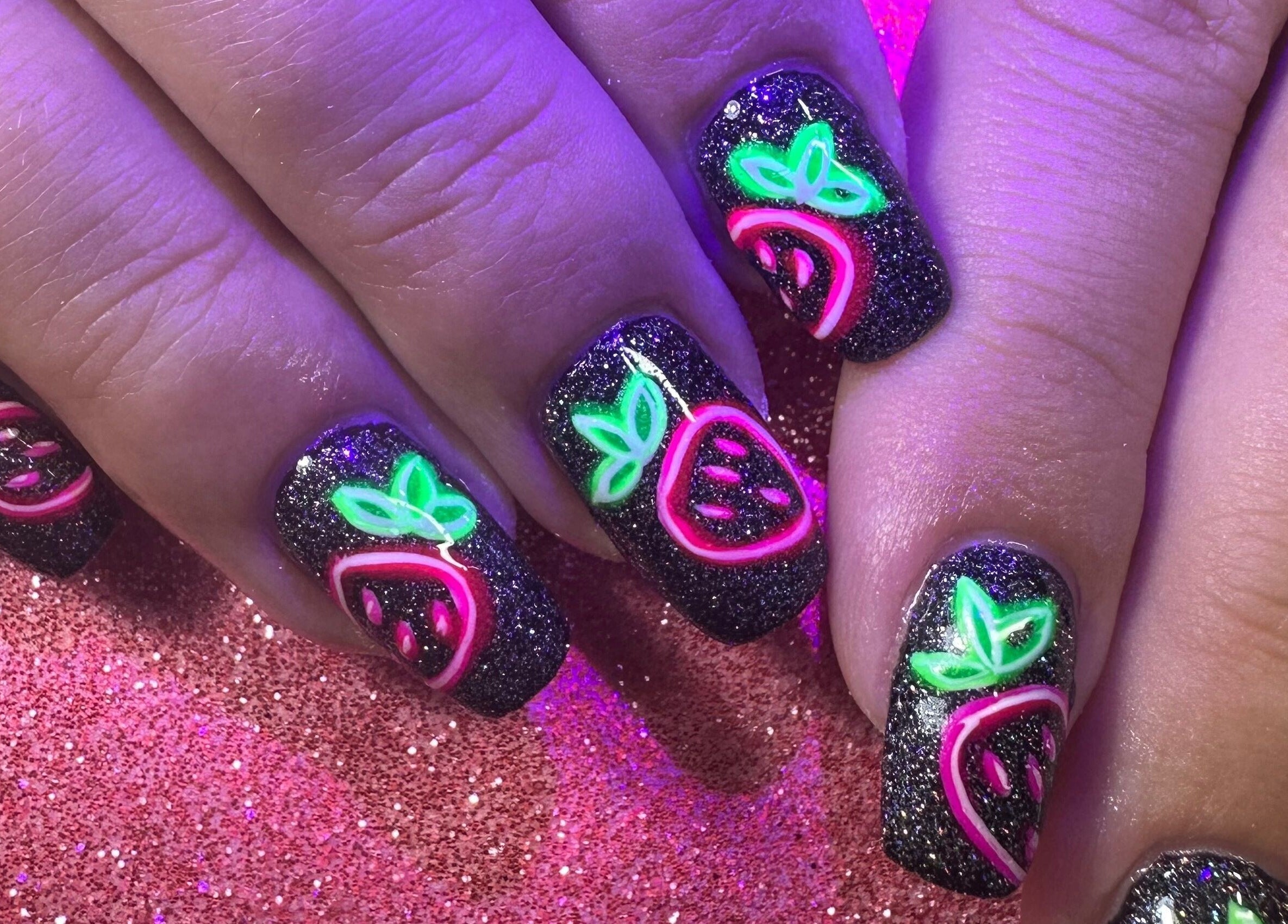 Neon fruit nail art on glittery background by Emi Nail Art, Gibraltar, GI.