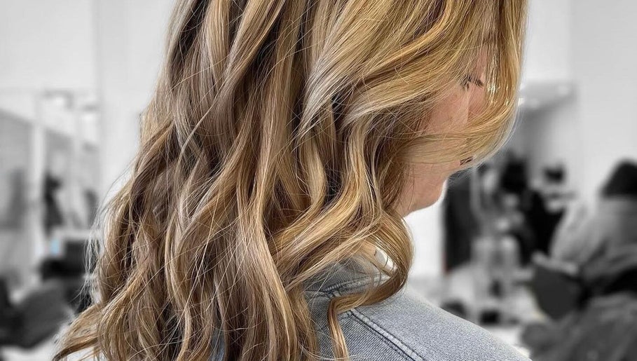 Golden wavy hairstyle at Vivid Hair Studio, Antigonish, Nova Scotia, CA.
