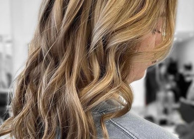 Golden wavy hairstyle at Vivid Hair Studio, Antigonish, Nova Scotia, CA.