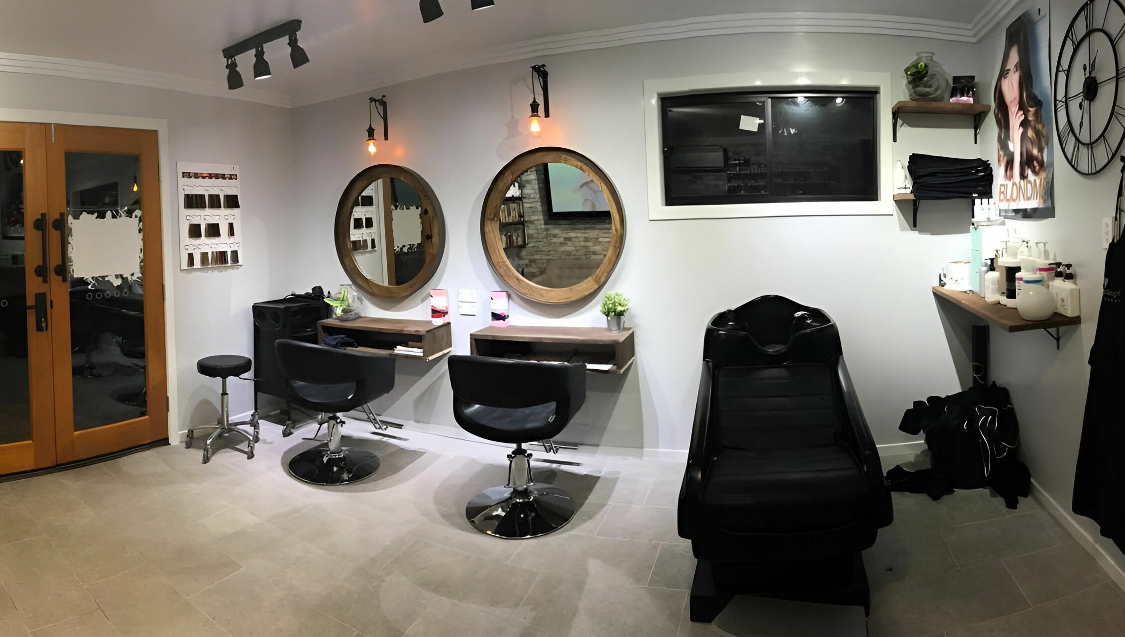 Cozy salon interior at Rachael's House of Colour, Stapylton, QLD, AU, featuring stylish chairs and mirrors.