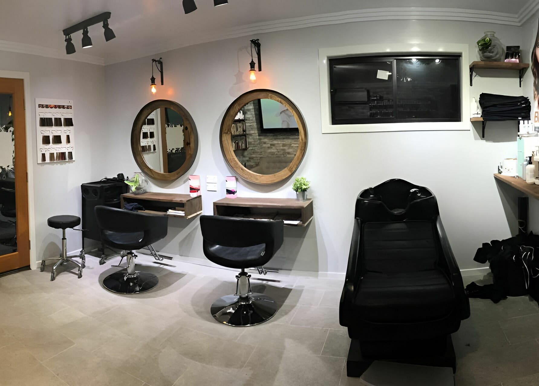 Cozy salon interior at Rachael's House of Colour, Stapylton, QLD, AU, featuring stylish chairs and mirrors.