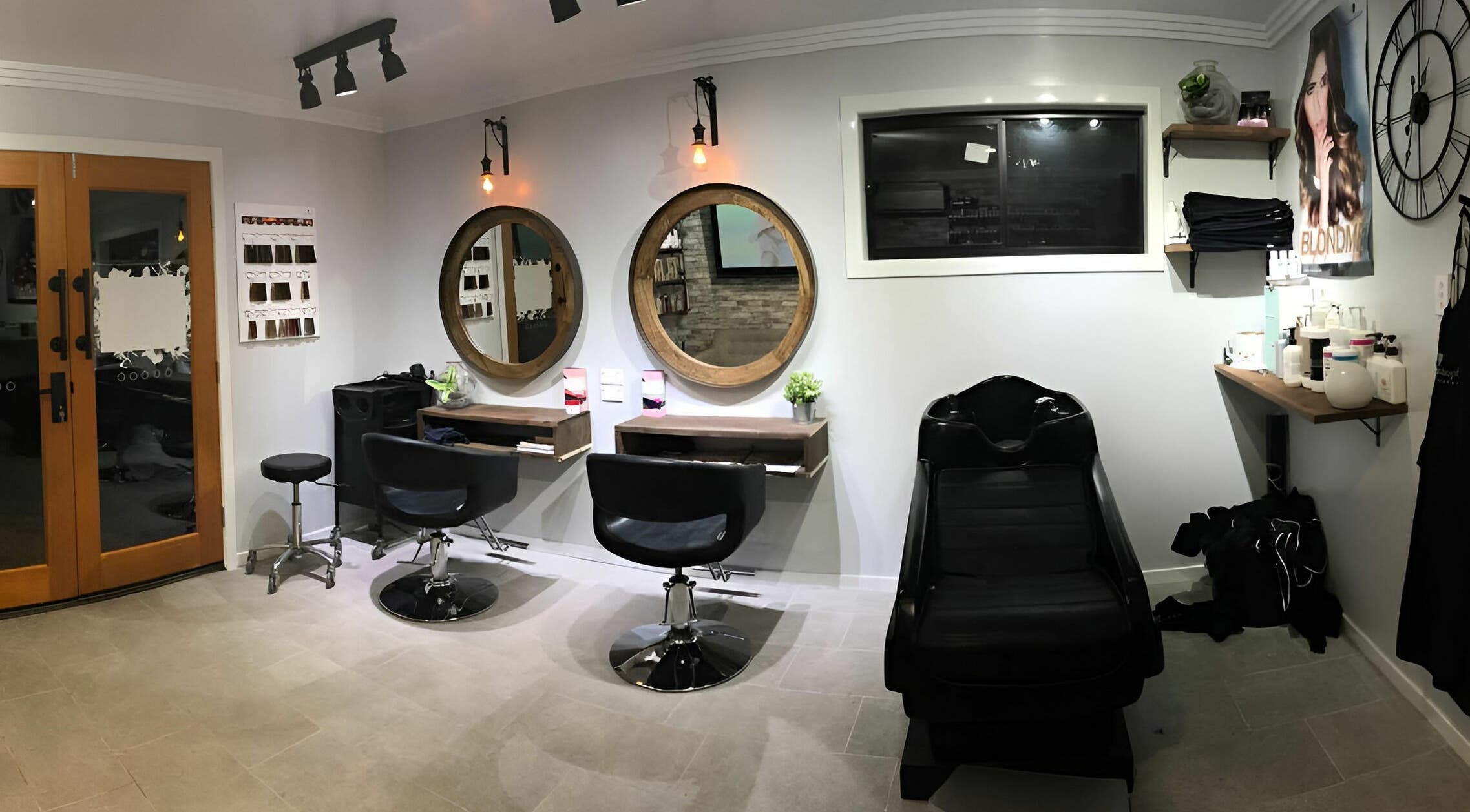 Cozy salon interior at Rachael's House of Colour, Stapylton, QLD, AU, featuring stylish chairs and mirrors.