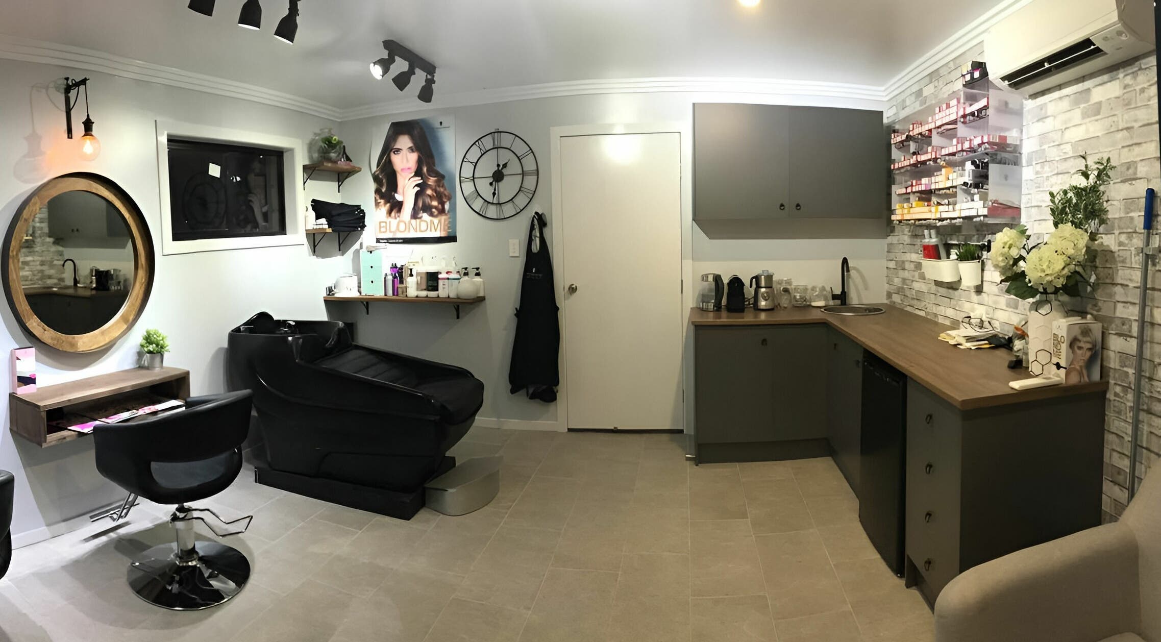Modern salon interior at Rachael's House of Colour, Stapylton, QLD, AU featuring elegant chairs and beauty products.