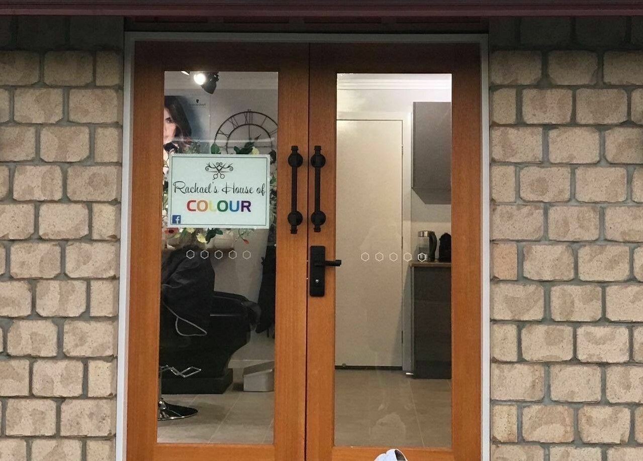 Front entrance of Rachael's House of Colour in Stapylton, QLD, AU showcasing its inviting salon door.