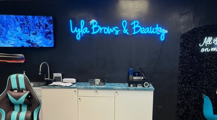 Lyla Brows & Beauty, Deerfield Beach, Florida, US: Stylish interior view with neon sign and modern furnishings.