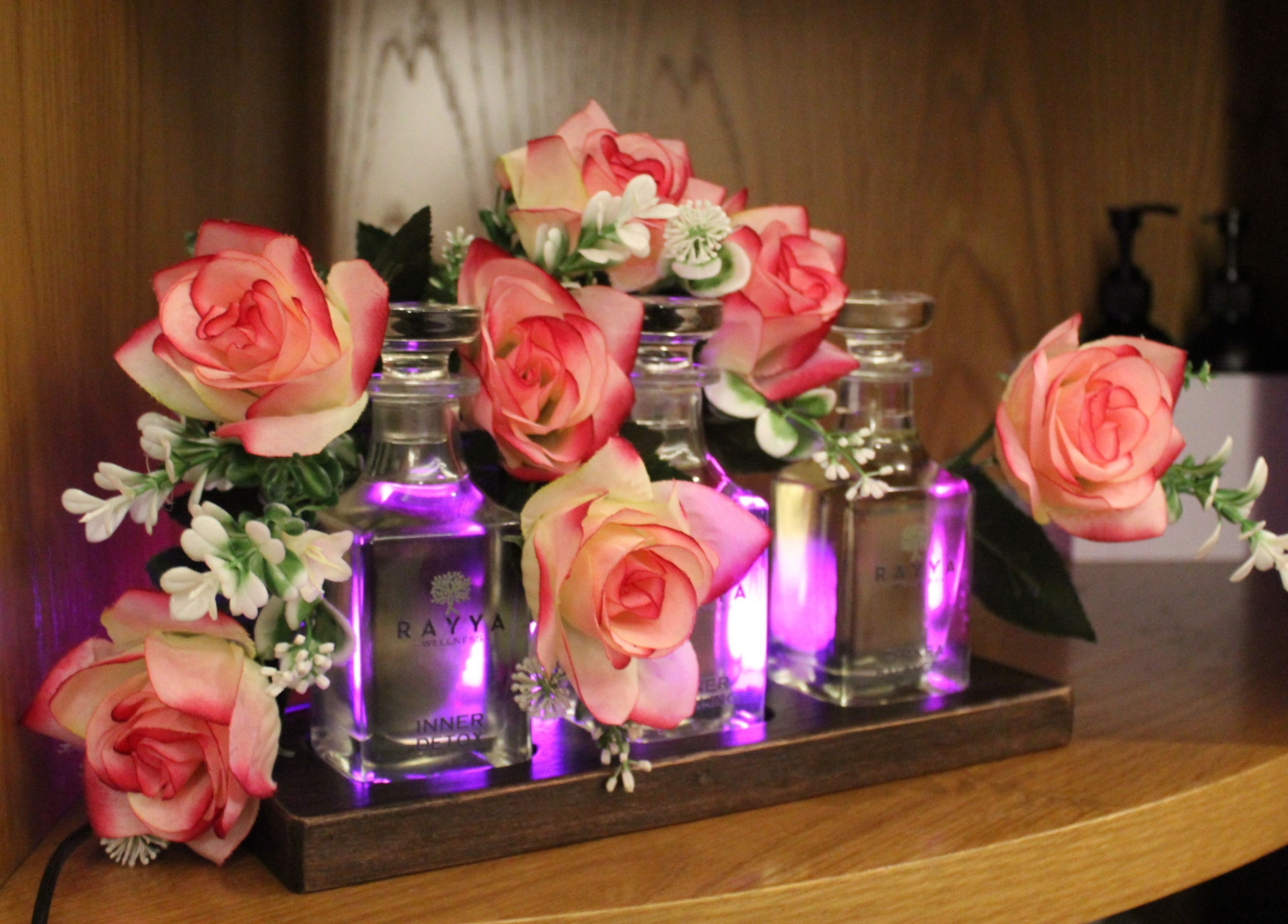 Elegant floral arrangement with Rayya Wellness oils at the First Collection | Business Bay, Dubai, Dubai, AE.