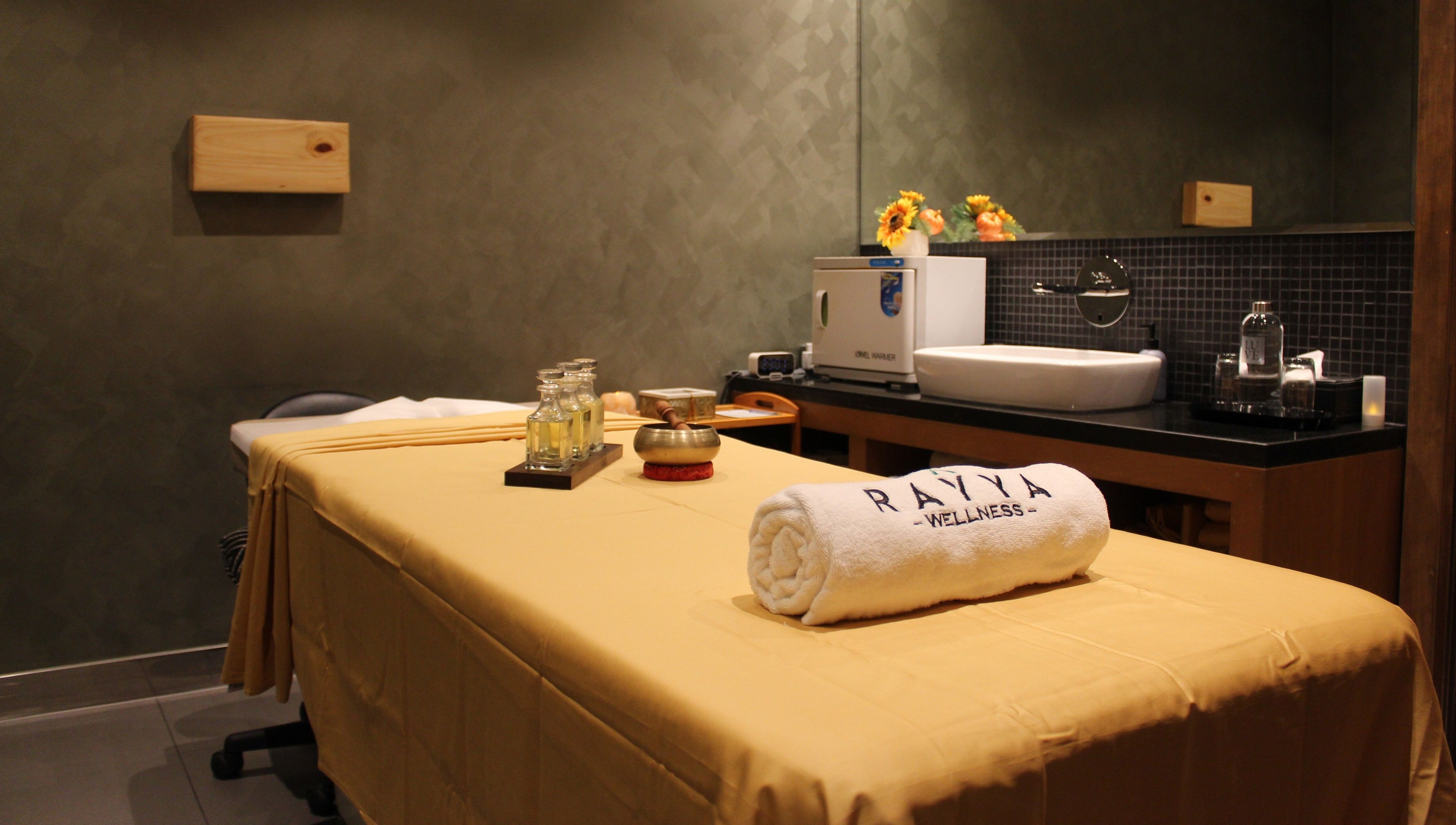 Calm spa room at Rayya Wellness | TRYP, Al Saef, Dubai, AE with massage table and soothing decor.