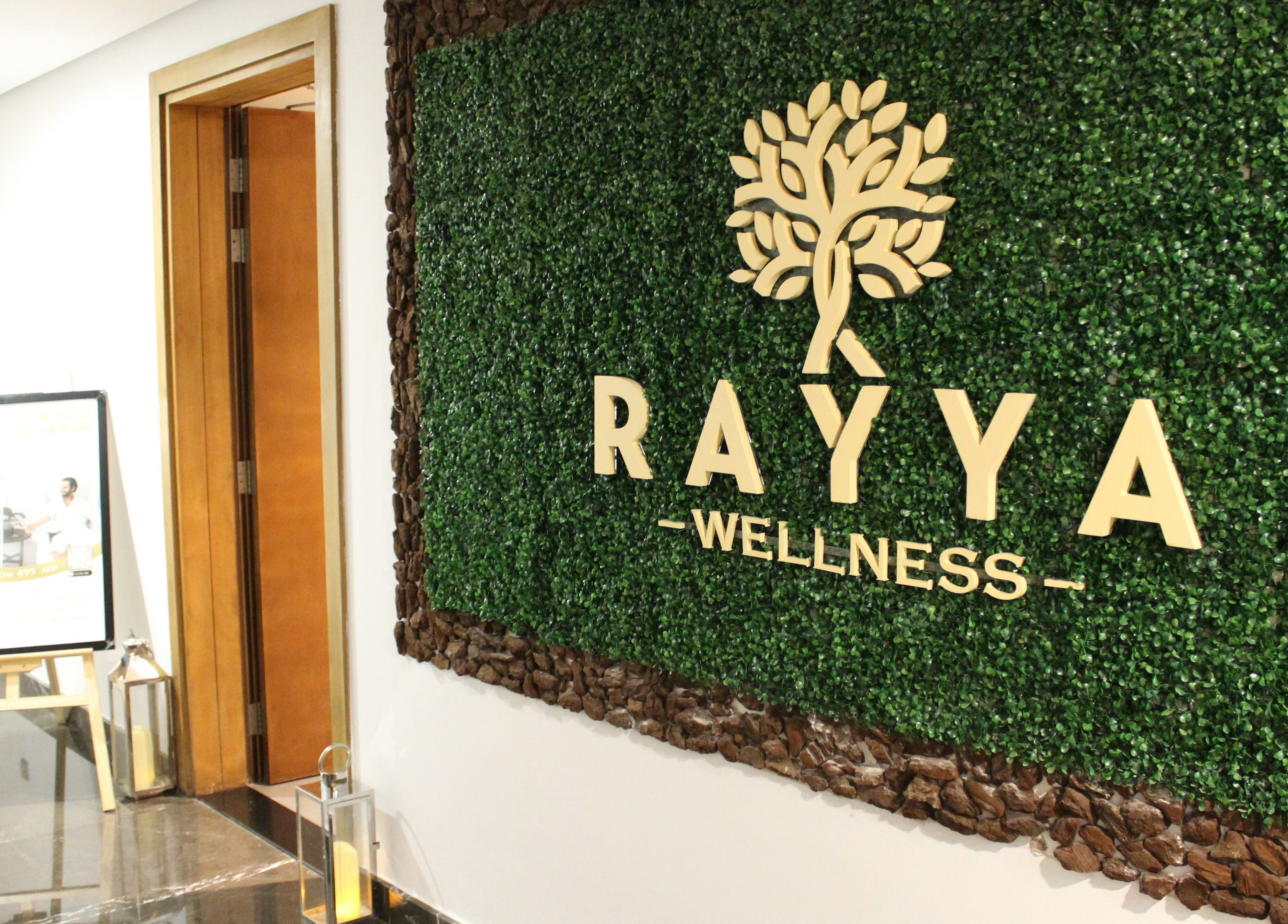 Rayya Wellness entrance with lush green decor at TRYP, Al Saef, Dubai, AE.